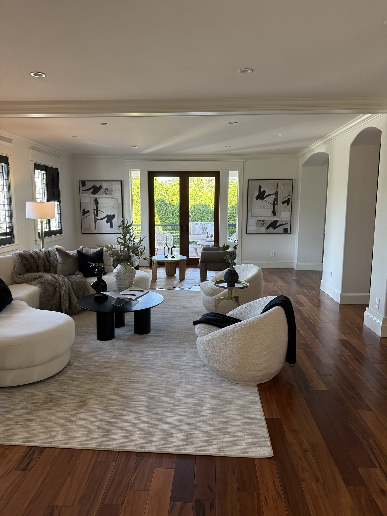 Finished residence with warm wood floors, carefully painted walls, detailed trim and natural light
